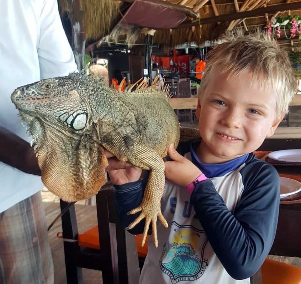 boy with iguana